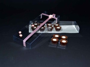 Variety of chocolate truffles, pralines in a plastic box